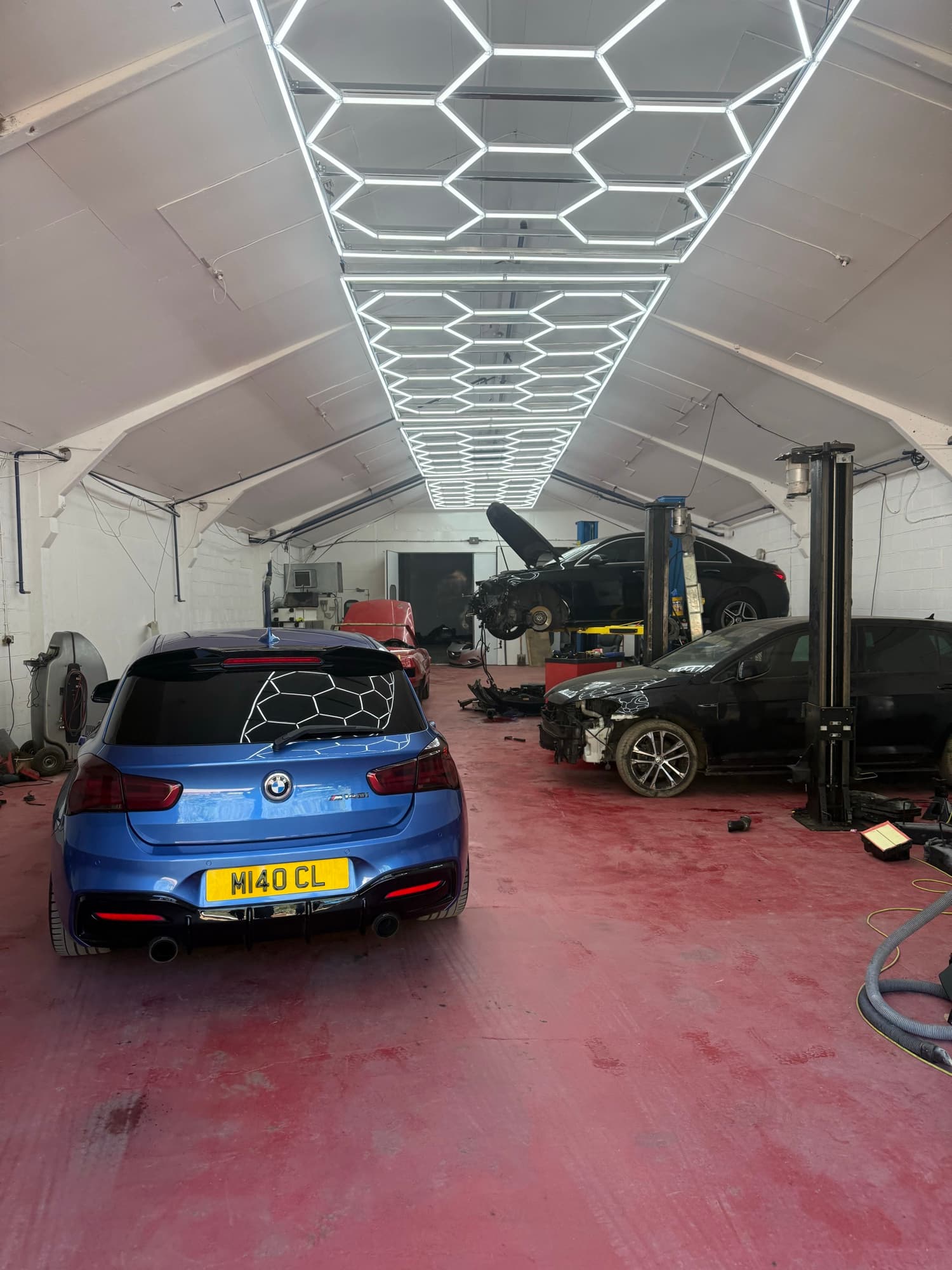 LRC Autoworks workshop interior with hexagonal lighting