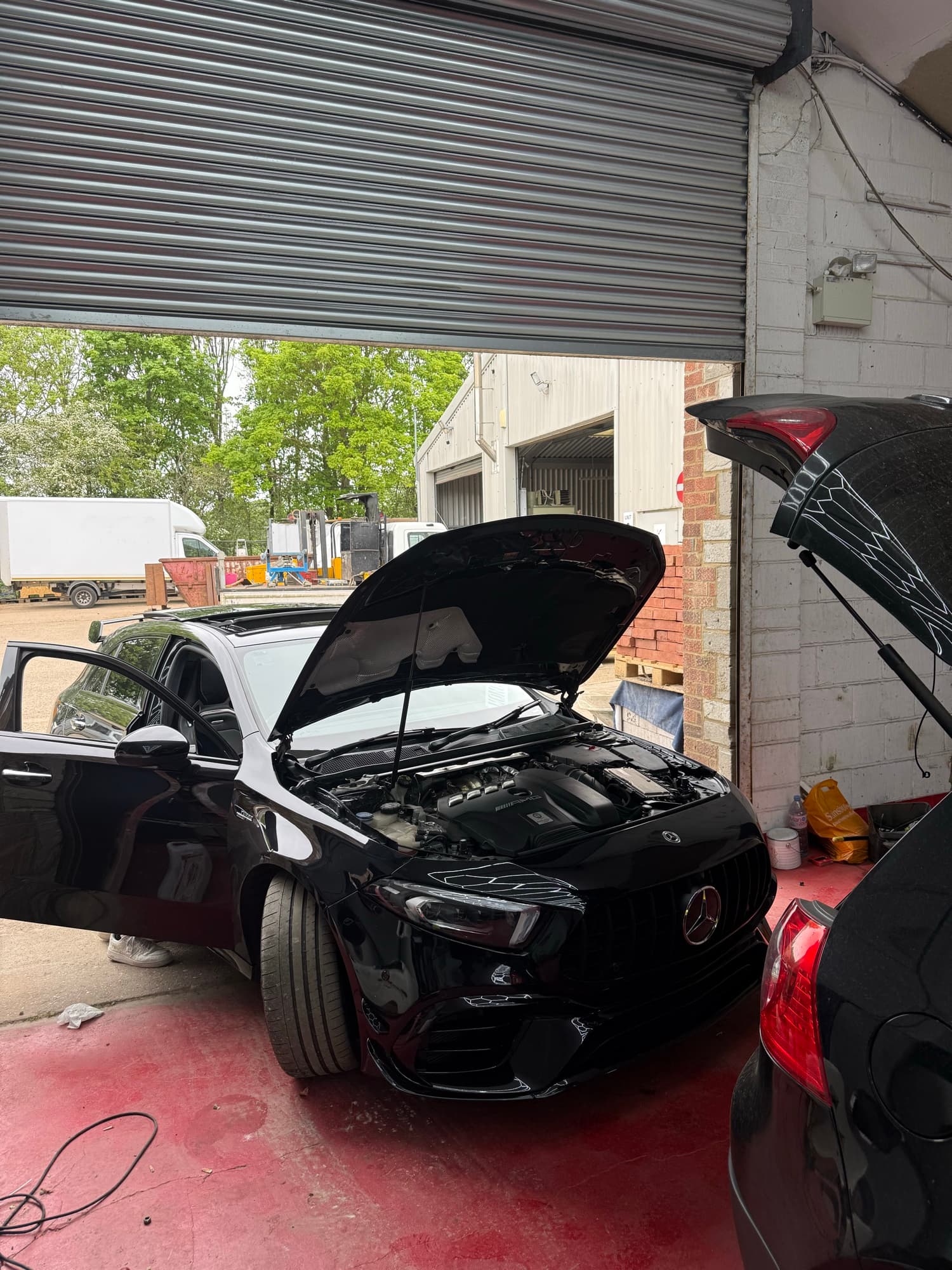Mercedes-AMG GT 63 with bonnet up for performance servicing